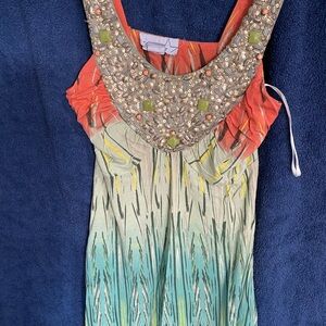 Beautiful, funky summer top.colourful and playfully elegant